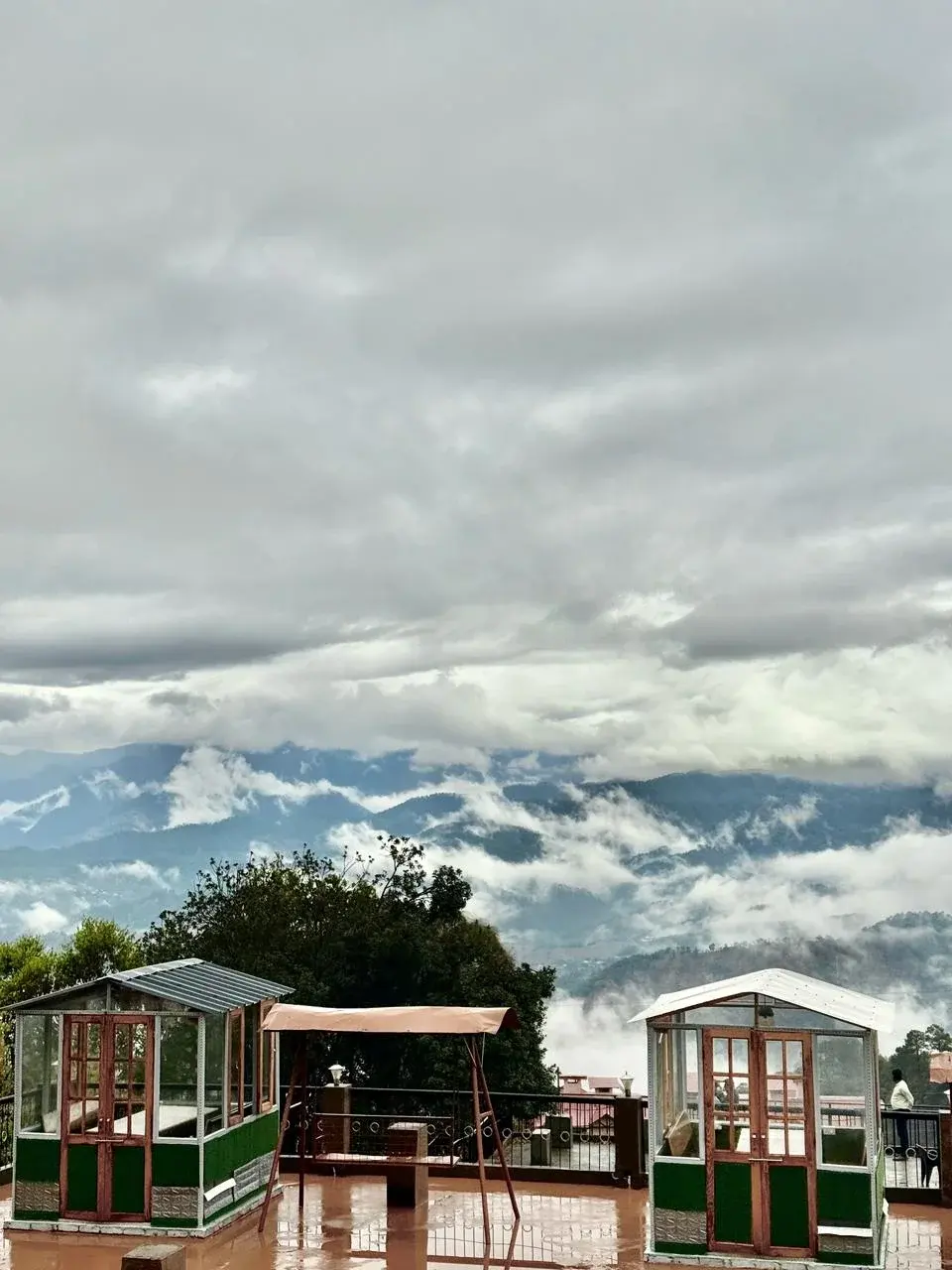 Gazebos overlooking a beautiful cloudy valley from the hotel's terrace